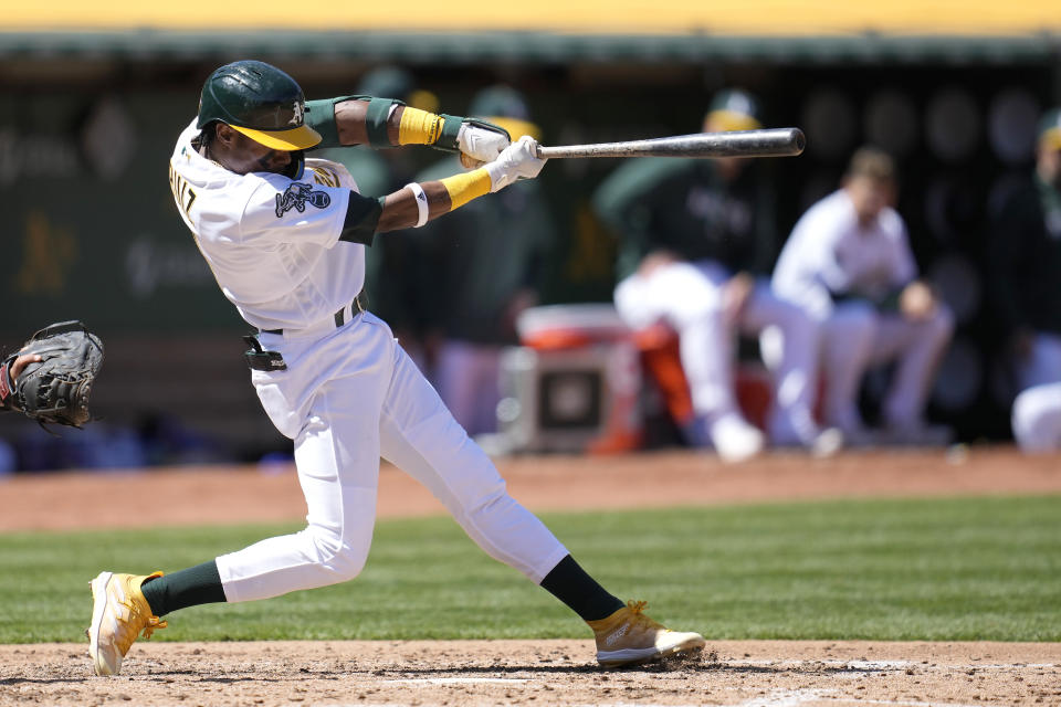 Oakland Athletics' Esteury Ruiz hits an RBI-single against the New York Mets during the fifth inning of a baseball game in Oakland, Calif., Sunday, April 16, 2023. (AP Photo/Jeff Chiu)
