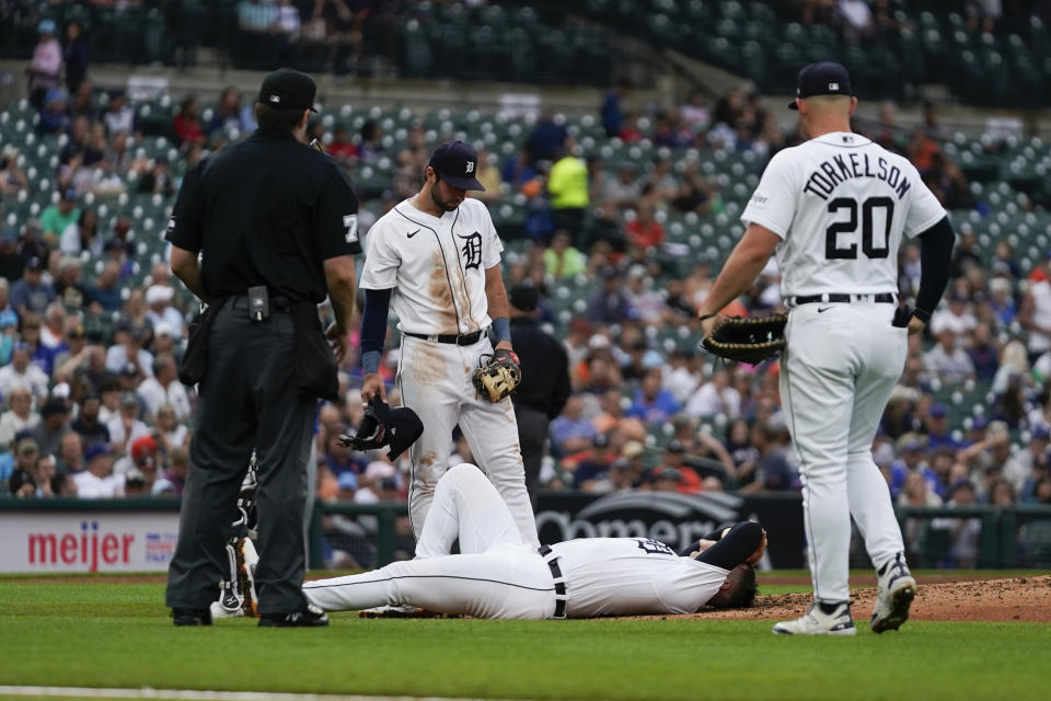 Detroit Tigers pitcher Tarik Skubal lies on the mound after being hit by a Chicago Cubs' Yan Gomes line drive in the fourth inning of a baseball game, Wednesday, Aug. 23, 2023, in Detroit. (AP Photo/Paul Sancya)