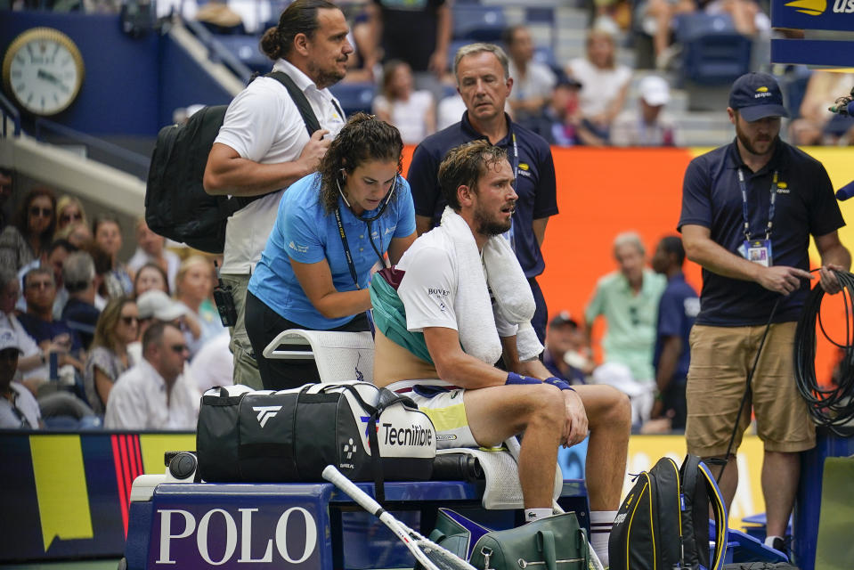 Daniil Medvedev, of Russia, is attended to by a trainer during a break in play against Andrey Rublev, of Russia, during the quarterfinals of the U.S. Open tennis championships, Wednesday, Sept. 6, 2023, in New York. (AP Photo/Seth Wenig)