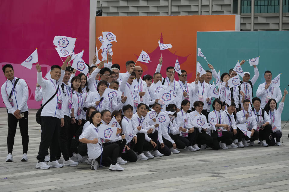 Athletes and team officials from Taiwan pose for a group photo during a team welcoming ceremony at the 19th Asian Games in Hangzhou, China, Friday, Sept. 22, 2023. (AP Photo/Aaron Favila)