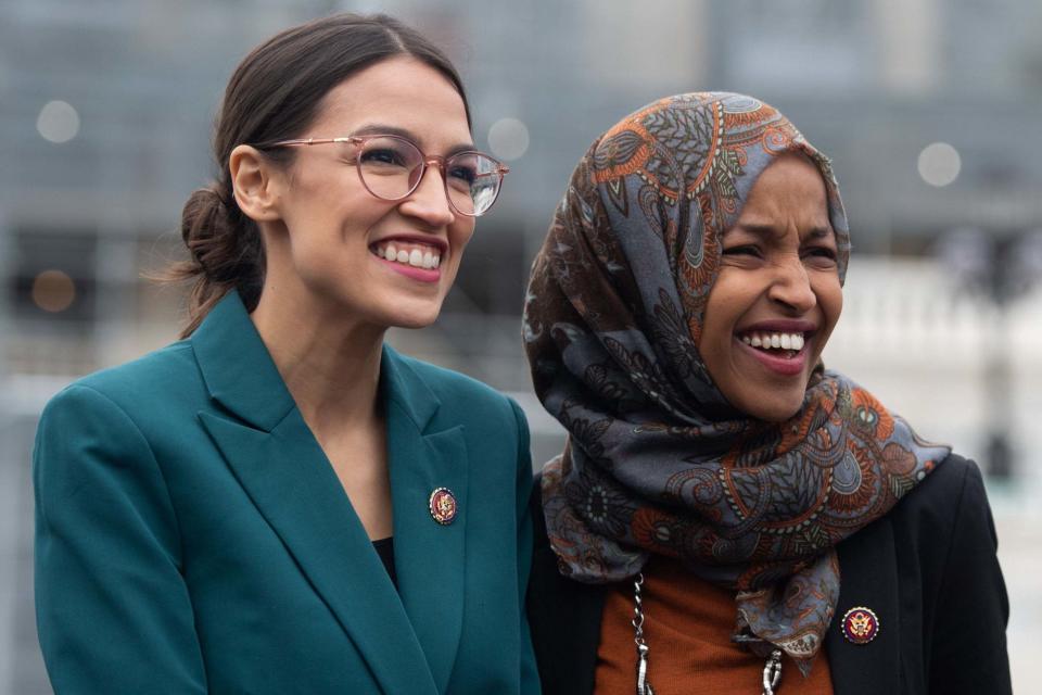 US Representative Alexandria Ocasio-Cortez, Democrat of New York, and US Representative Ilhan Omar (R), Democrat of Minnesota (AFP/Getty Images)