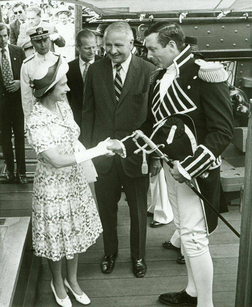 Commanding Officer Tyrone G. Martin welcomed Queen Elizabeth II aboard USS Constitution, along with Secretary of the Navy J. William Middendorf, center, and Prince Philip, in background, on July 11, 1976.