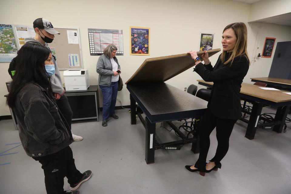 Students Melissa Tobin of Fairport and Cody Mayer get a tour of the laboratories in the Optical Systems Technology Program at Monroe Community College in Brighton, March 23, 2022