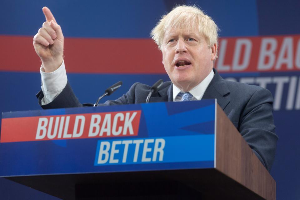 British Prime Minister Boris Johnson makes a speech at the Conservative Party's annual conference in Manchester, Britain, on Oct. 6, 2021. Johnson on Wednesday vowed to change the direction of the British economy, shifting away from its reliance on cheap imported labor, as he shrugged off the ongoing fuel, food and industry crises as 