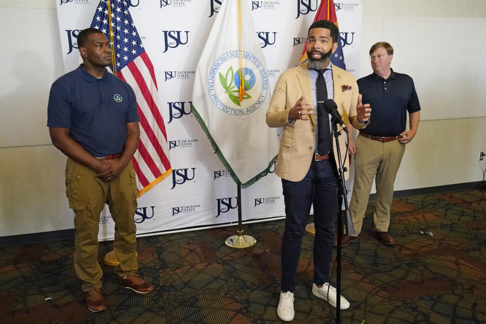 Jackson Mayor Chokwe Antar Lumumba discusses elements of a coordinated response with federal agencies, that he believes will help deal with the city's long-standing water problems, during a news briefing, Sept. 7, 2022, in Jackson, Miss. Lumumba also conferred with Environmental Protection Agency Administrator Michael S. Regan, left, and Mississippi Gov. Tate Reeves, right, and other officials to explore options. (AP Photo/Rogelio V. Solis)