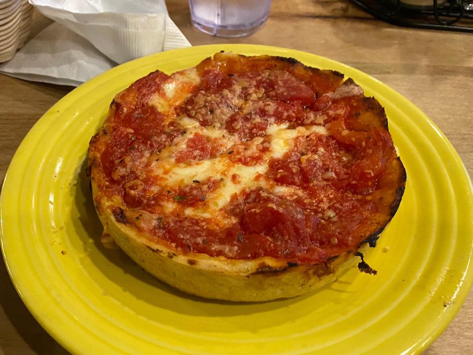 the deep dish pizza on a plate at lou malnati's in chicago