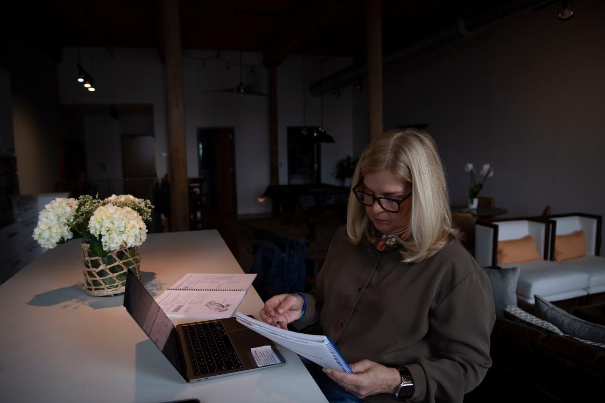 Kellie Reifenberger, teacher at Covenant School, works on her lesson plan before her day begins at her home in Nashville, Tenn., Wednesday, March 6, 2024. Reifenberger has been working at Brentwood Hills Church of Christ with the rest of the faculty since last years school shooting.