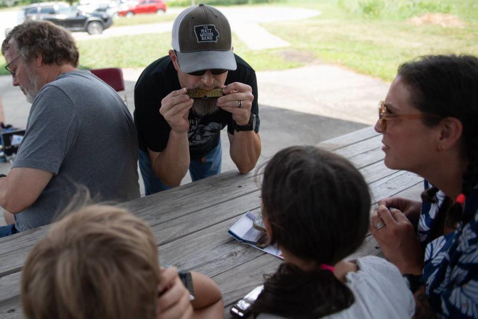 Russ “KidMan” Schenke demonstrates playing using the harmonica’s interior plate during Make Music Day.