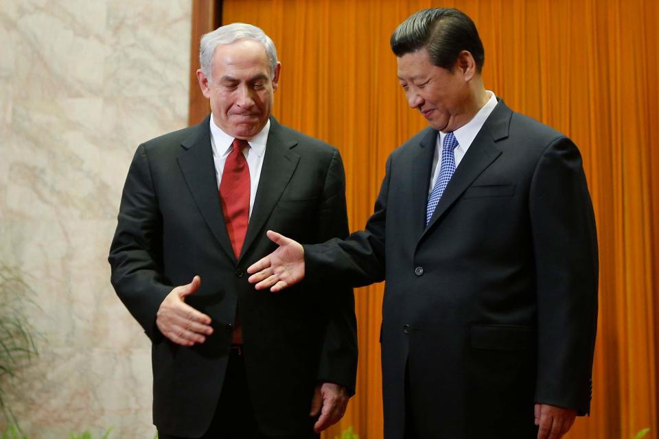 China’s President Xi Jinping shakes hands with Israeli Prime Minister Benjamin Netanyahu at the Great Hall of the People on May 9, 2013 in Beijing, China. <span class="copyright">Getty Images</span>