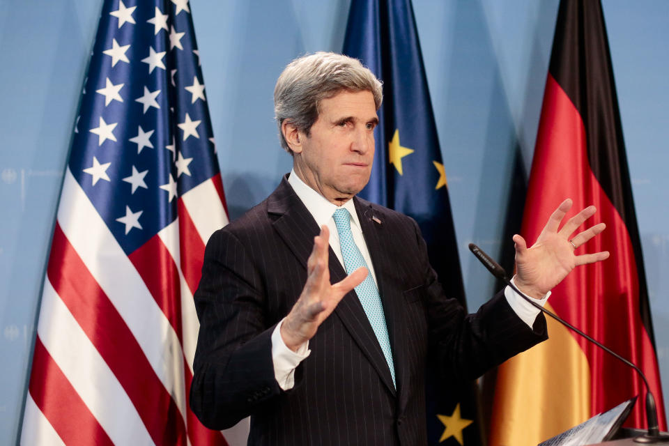 US Secretary of State John Kerry briefs the media after a meeting with German Foreign Minister Frank-Walter Steinmeier at the airport Tegel in Berlin, Germany, Friday, Jan. 31, 2014. Kerry is on a stopover in the German capital en route to the Munich Security Conference. (AP Photo/Markus Schreiber)