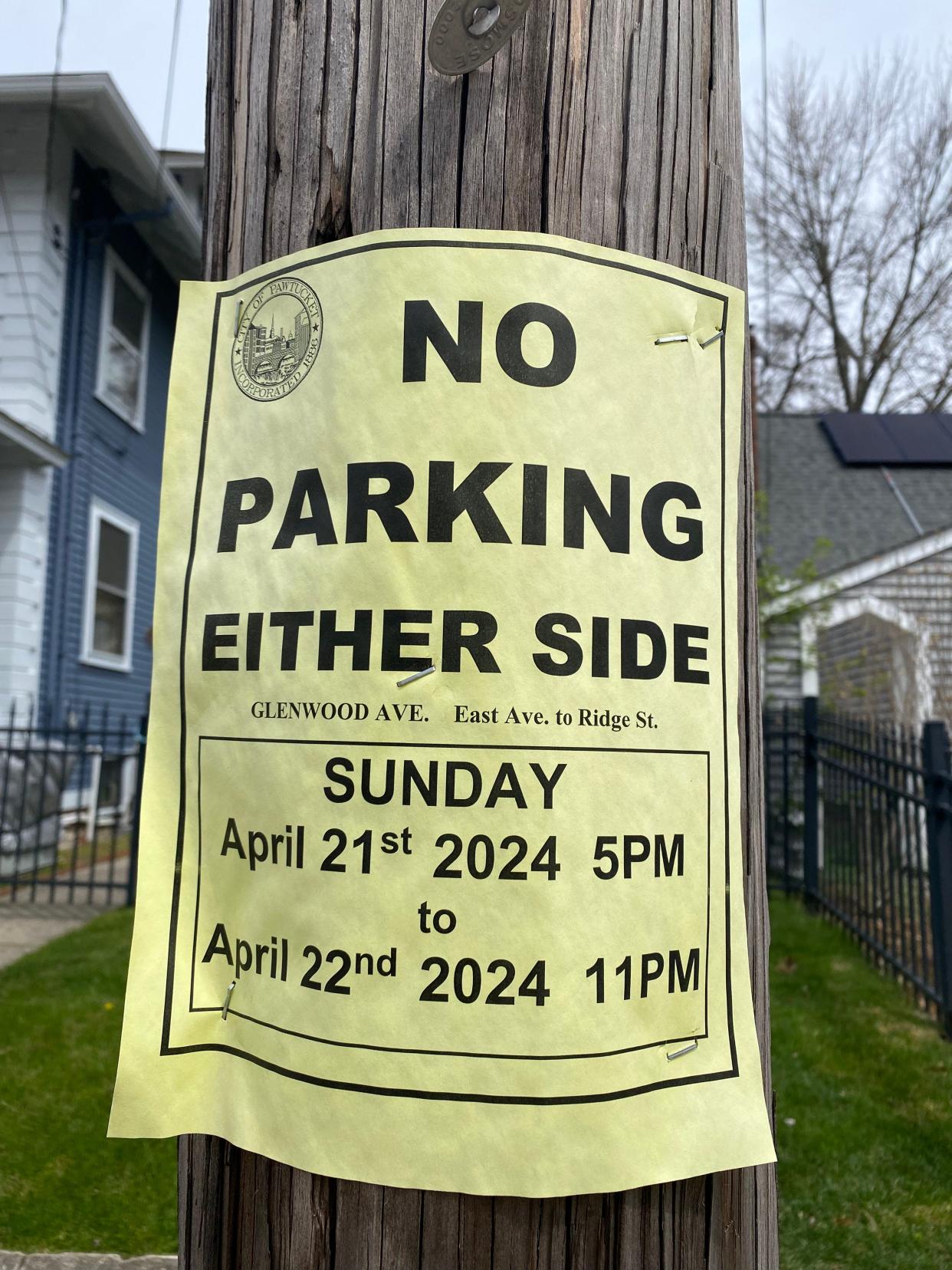 Signs on sides streets off Pawtucket's East Avenue restrict parking for Sunday and Monday.