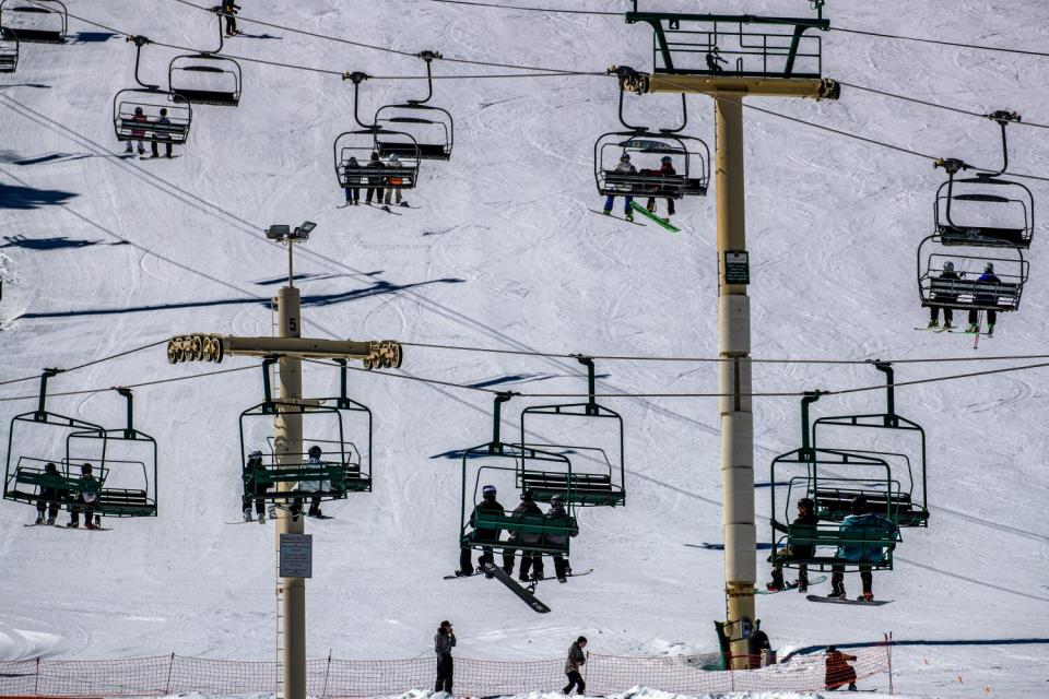 Skiers and snow boarders ascended upon Big Bear Mountain Resort on a sunny in March 2023 in Big Bear, CA.