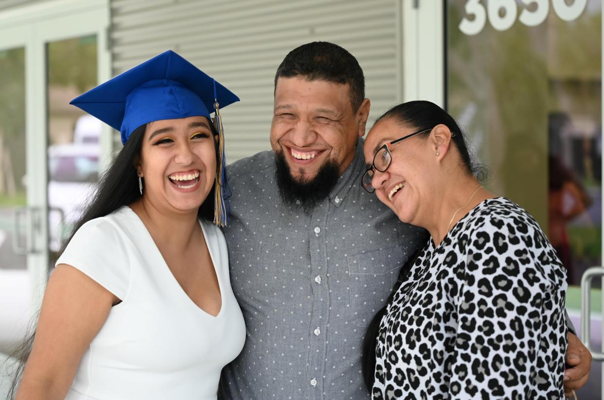 Big smiles capture the occasion for UnidosNow Future Leaders Academy graduate Maria Prisila E. and her parents. She will be attending New College of Florida.