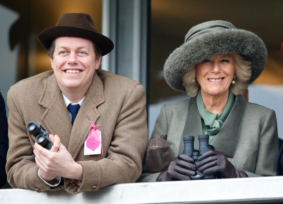 CHELTENHAM, UNITED KINGDOM - MARCH 11: (EMBARGOED FOR PUBLICATION IN UK NEWSPAPERS UNTIL 48 HOURS AFTER CREATE DATE AND TIME) Camilla, Duchess of Cornwall (right) and her son Tom Parker Bowles watch the racing as they attend day 2 of the Cheltenham Festival at Cheltenham Racecourse on March 11, 2015 in Cheltenham, England. (Photo by Max Mumby/Indigo/Getty Images)