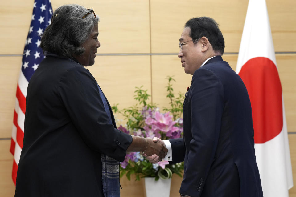 U.S. Ambassador to United Nations Linda Thomas-Greenfield, left, and Japan's Prime Minister Fumio Kishida, right, shake hands during a meeting Friday, April 19, 2024, at prime minister's office in Tokyo. (AP Photo/Eugene Hoshiko, Pool)