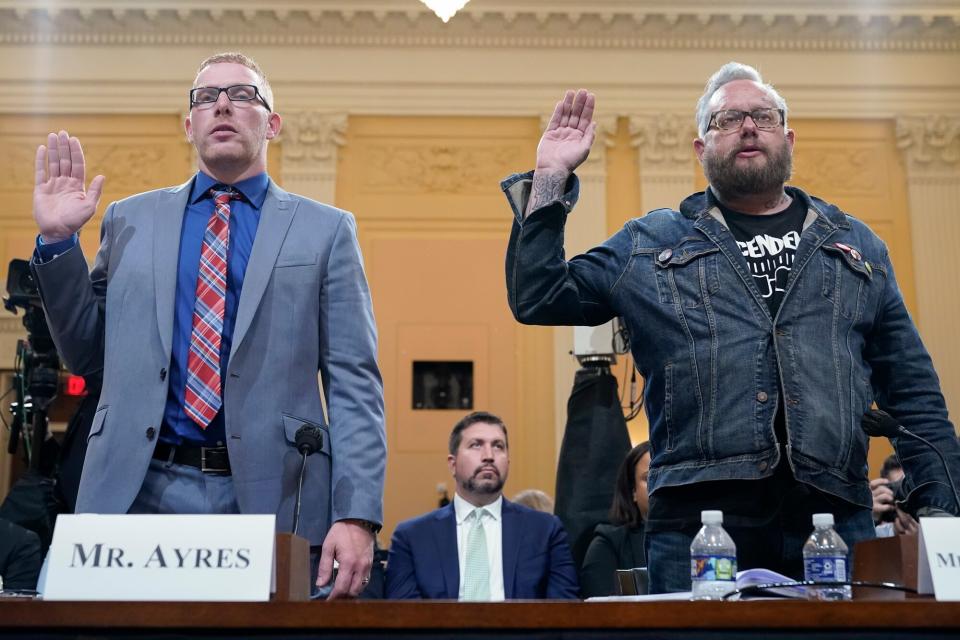 Stephen Ayres, who pleaded guilty last in June 2022 to disorderly and disruptive conduct in a restricted building, left, and Jason Van Tatenhove, an ally of Oath Keepers leader Stewart Rhodes, right, are sworn in to testify as the House select committee investigating the Jan. 6 attack on the U.S. Capitol holds a hearing at the Capitol in Washington, Tuesday, July 12, 2022.