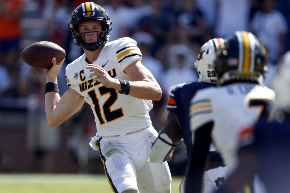 Missouri quarterback Brady Cook (12) throws a pass against Auburn during the second half of an NCAA college football game, Saturday, Sept. 24, 2022 in Auburn, Ala. (AP Photo/Butch Dill)