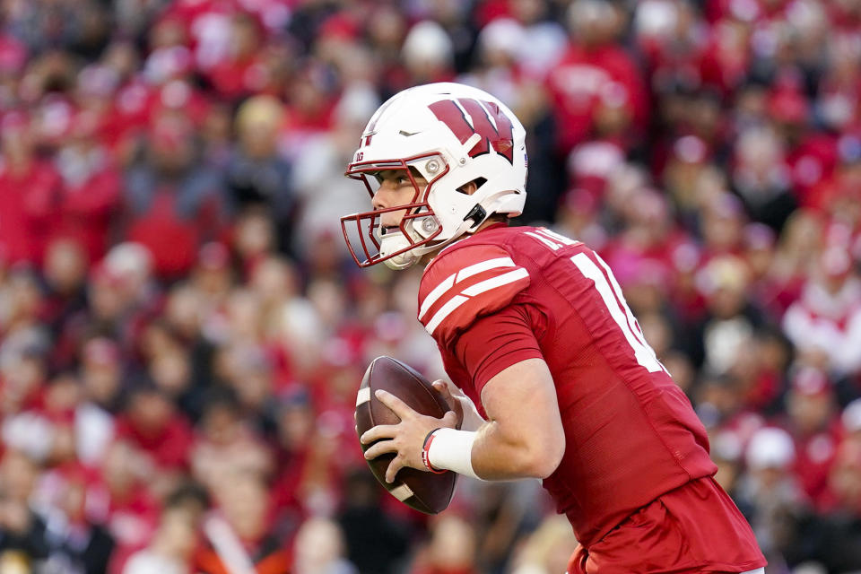 Wisconsin quarterback Braedyn Locke looks to throw against Iowa during the second half of an NCAA college football game Saturday, Oct. 14, 2023, in Madison, Wis. (AP Photo/Andy Manis)