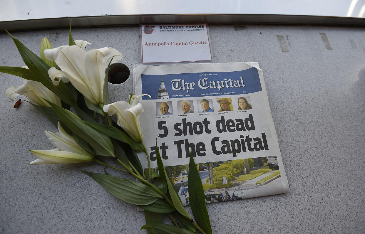 A memorial for the five Capital Gazette employees killed during Thursday's mass shooting is displayed in the Camden Yards press box. (AP)