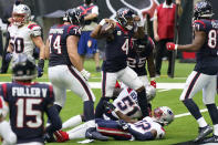 Houston Texans quarterback Deshaun Watson (4) flexes as he celebrates scoring a touchdown against the New England Patriots during the first half of an NFL football game, Sunday, Nov. 22, 2020, in Houston. (AP Photo/David J. Phillip)