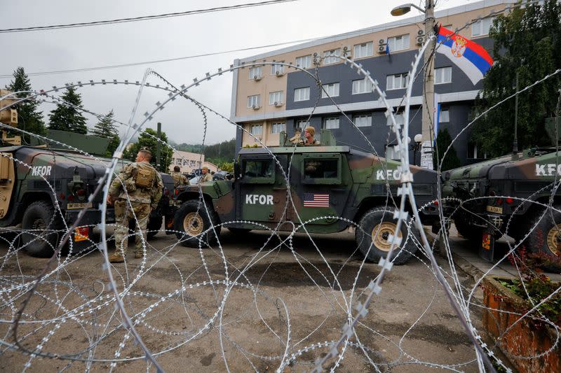 Members of the NATO-led Kosovo Force (KFOR) stand guard in Leposavic