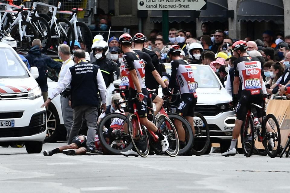 Caleb Ewan's Lotto teammates gather around him after his crash during the final spring on stage three of the Tour de France. (Photo by PHILIPPE LOPEZ/POOL/AFP via Getty Images)