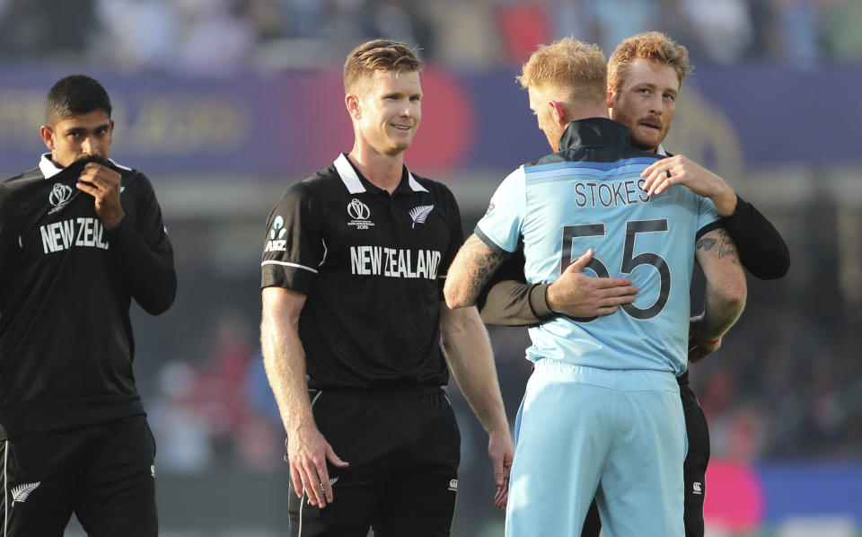 New Zealand's cricketers congratulate England's Ben Stokes after England won the Cricket World Cup final match between England and New Zealand at Lord's cricket ground in London, England, Sunday, July 14, 2019. (AP Photo/Aijaz Rahi)