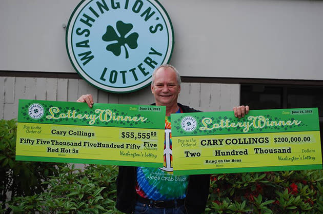 Cary Collings holds up his winnings (Photo via Facebook)