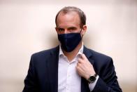 FILE PHOTO: Britain's Foreign Affairs Secretary Dominic Raab walks outside Downing Street in London