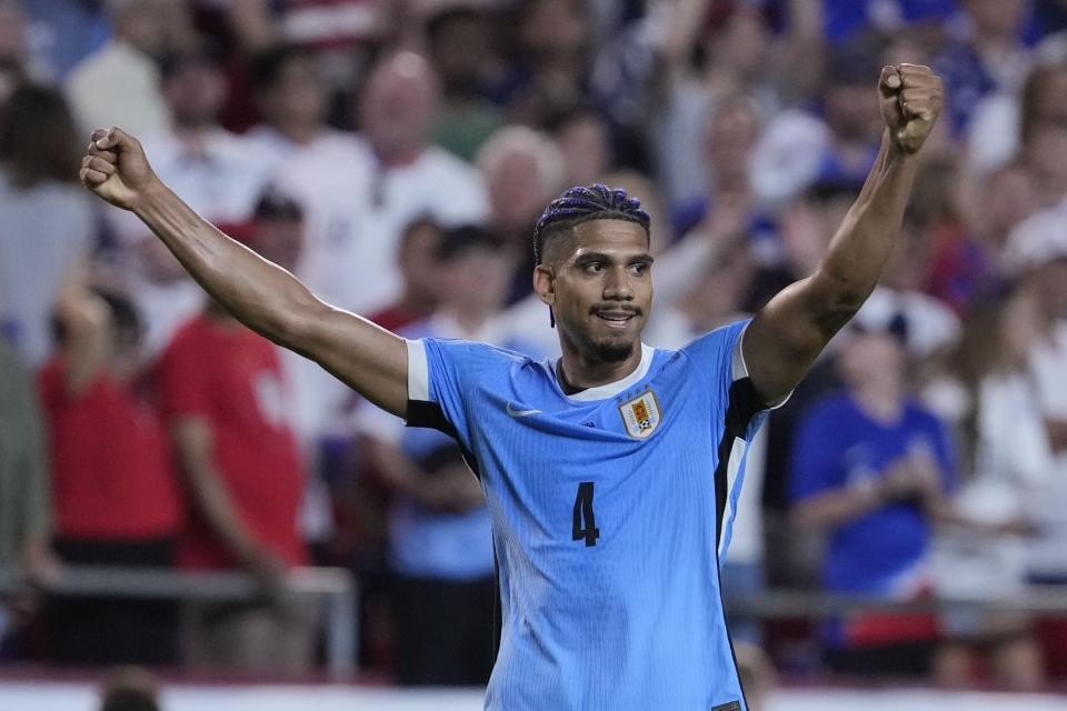 Uruguay's Ronald Araujo celebrates after his team defeated the United States in an Copa America Group C soccer match, Monday, July 1, 2024, in Kansas City, Mo. (AP Photo/Ed Zurga)