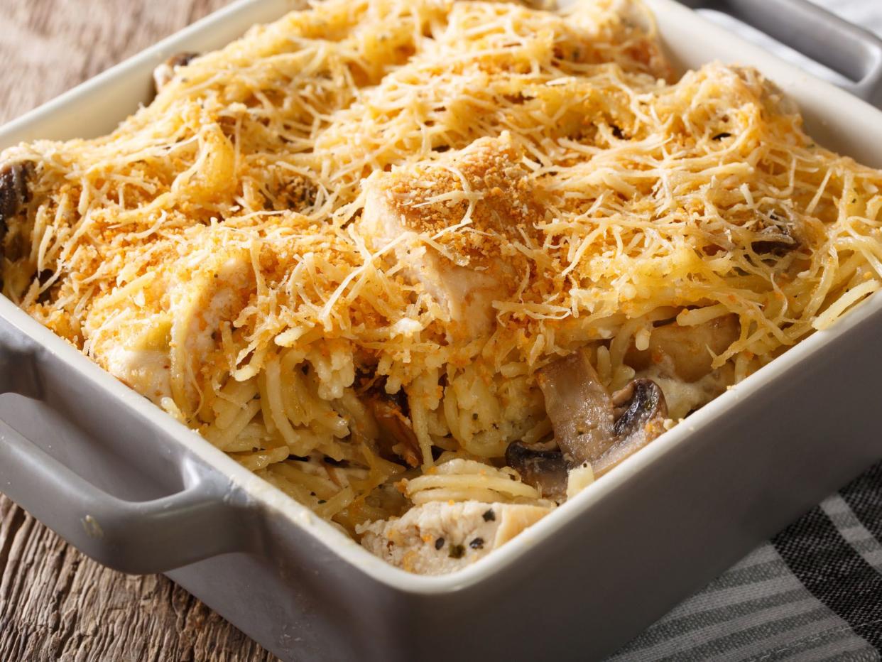 Tetrazzini is an American dish. Spaghetti with chicken, mushrooms and fresh grated parmesan cheese macro. horizontal