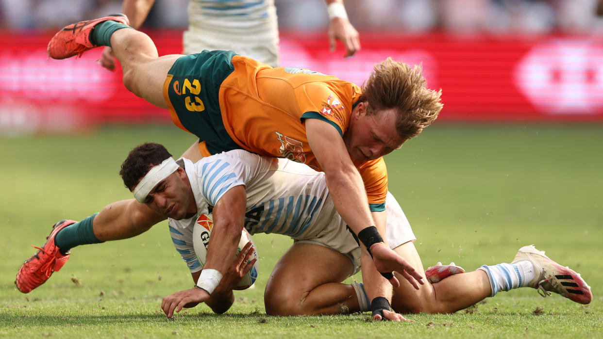  Australia player dives over Argentina player 