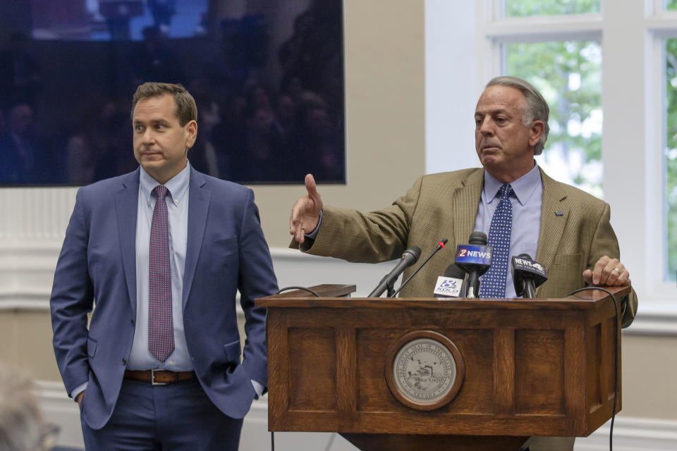 Nevada Governor Joe Lombardo, right, speaks as Nevada Secretary of State Cisco Aguilar looks on before he signs an election worker protection bill into law as Secretary of State Cisco Aguilar looks on at the old Assembly Chambers in Carson City, Nev., Tuesday, May 30, 2023. (AP Photo/Tom R. Smedes)