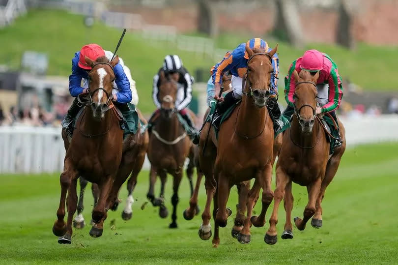 Rossa Ryan and Forest Fairy (left, red cap) win the Weatherbys ePassport Cheshire Oaks from Ryan Moore and Port Fairy (right, orange/blue) at Chester Racecourse on day one of the 2024 Boodles Chester May Festival on Wednesday, May 8 2024
