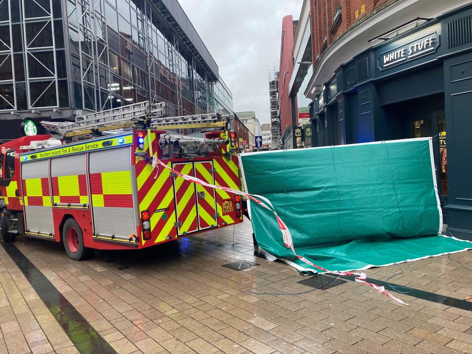 Emergency services at the scene where scaffolding has been dislodged in Belfast City centre during Storm Isha. A Status Red wind warning has been issued for counties Donegal, Galway and Mayo as authorities warn people to take care ahead of Storm Isha's arrival. Picture date: Sunday January 21, 2024.