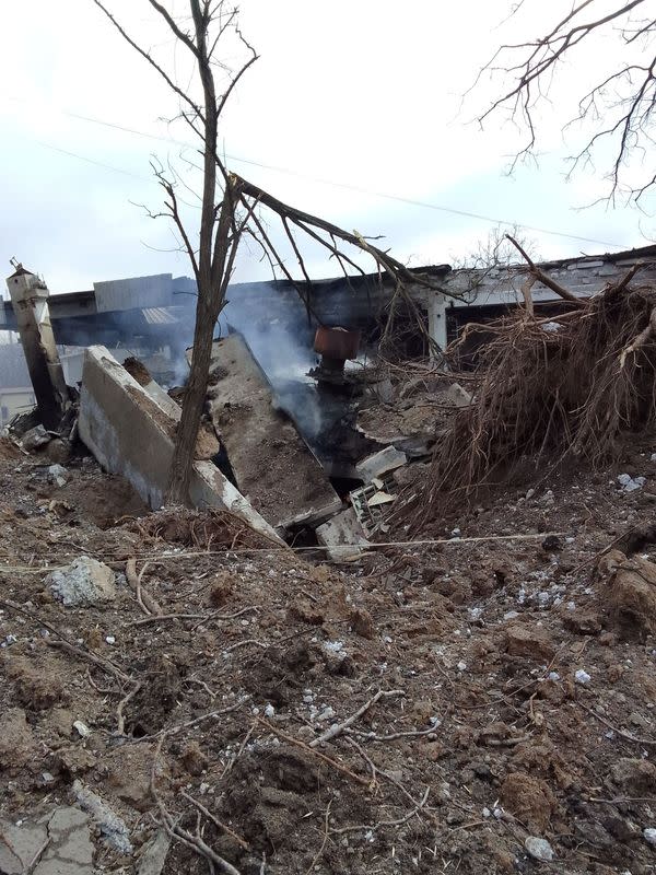 Smoke billows from the rubble near a destroyed building, amid Russia's invasion of Ukraine, in Mariupol