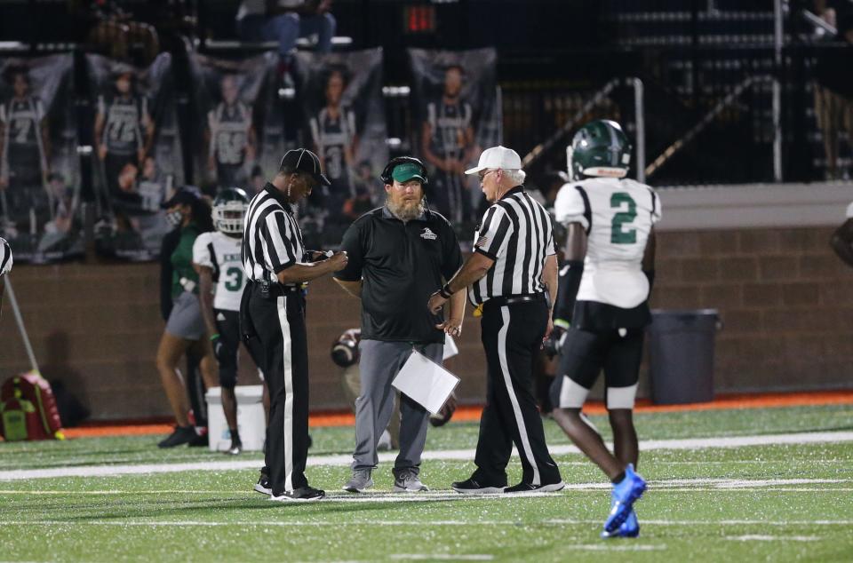 Windsor Forest coach Jeb Stewart talks to the officials during a 2021 game at Memorial Stadium.