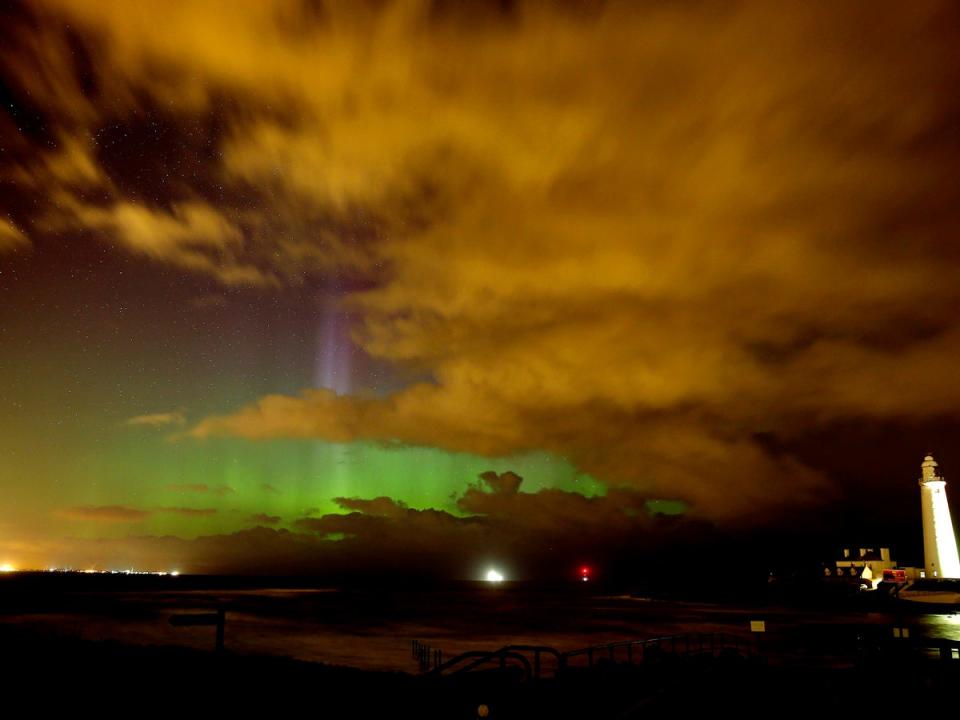 The sky surrounding St Mary's Lighthouse in Whitley Bay, Northumberland (PA)