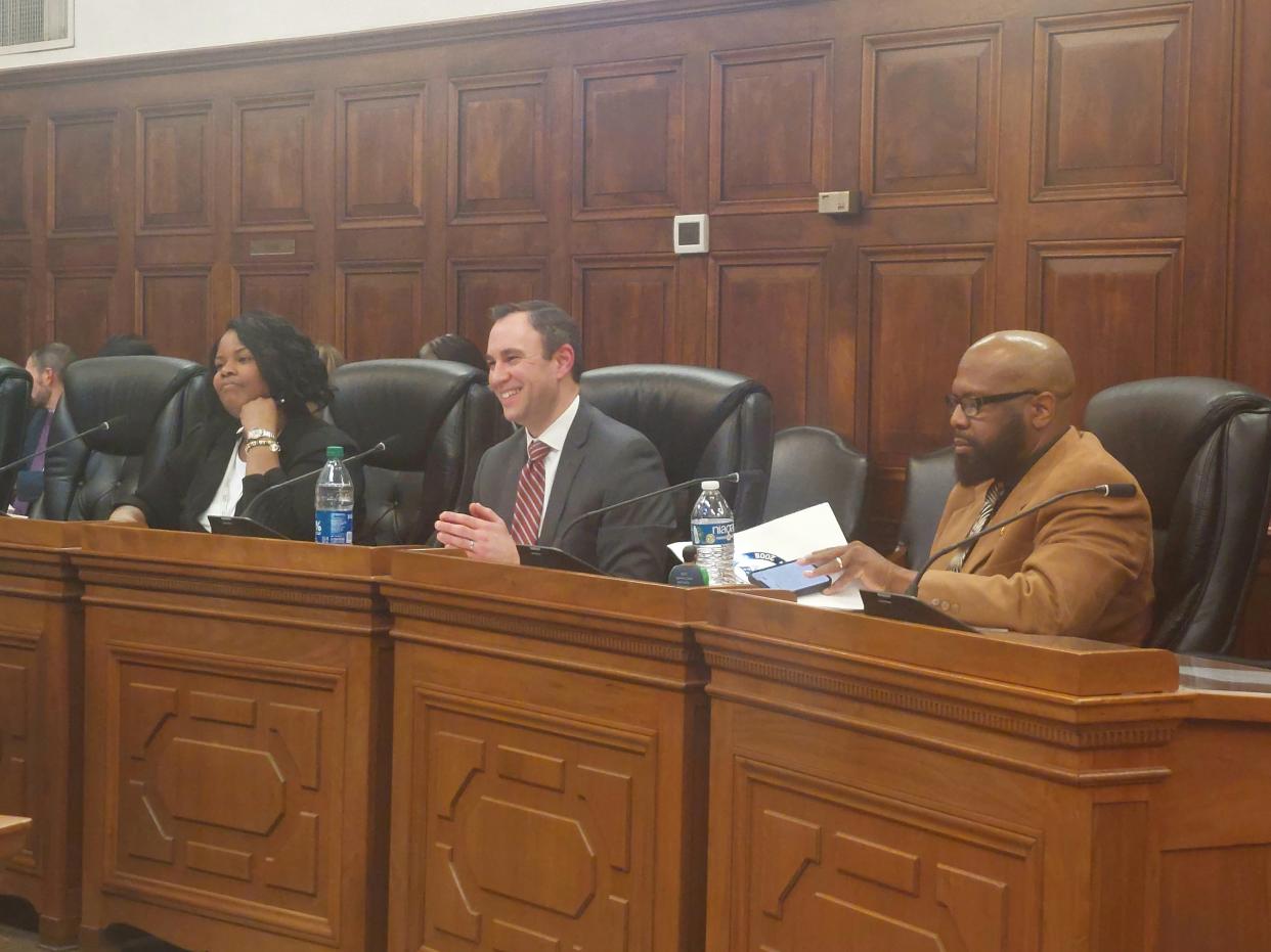 Summa Health's System Director of Government Affairs and Health Policy Tracy Carter and Chief Operating Officer Ben Sutton prepare to address Akron City Council on Monday.