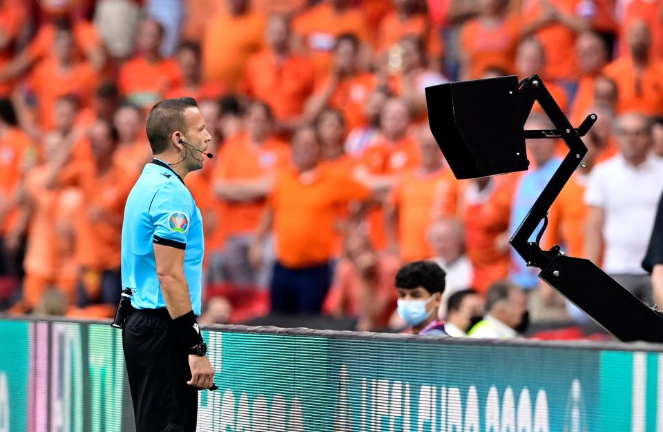 Referee Orel Grinfeld prepares to award a penalty to the Netherlands against Austria (Reuters)
