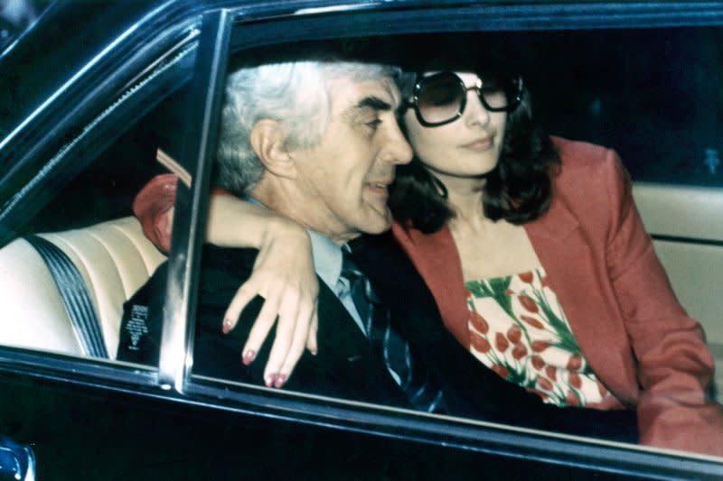 Automaker John DeLorean and his wife, model Christine Ferrare, leave terminal Island Federal Prison on October 29, 1982, in Los Angeles after he spent 11 days in jail on charges he financed a $24 million cocaine deal. File Photo by Glenn Wagnner/UPI