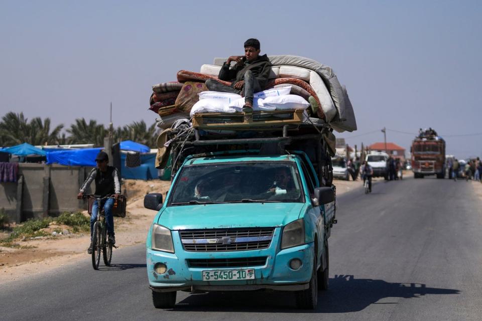 Displaced Palestinians arrive in central Gaza after fleeing from the southern Gaza city of Rafah (AP)