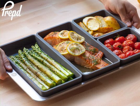 A set of modular sheet pan dividers so you can cool four different foods at once without overlap