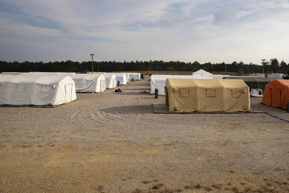 This photo provided by the U.S. Army shows large tents The 82nd Airborne Division has established to provide accommodations for up to 600 soldiers, shown March 17, 2020 at Fort Bragg, N.C. In one of Bragg's remote training areas, large tents have popped up over the last few days to house hundreds of 82nd Airborne Division troops that are returning to the base from Afghanistan and other Middle East deployments. (U.S. Army photo by Sgt. 1st Class Zach VanDyke via AP)