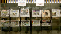 Newspapers headlining Prince Harry and Meghan’s explosive TV interview are displayed for sale outside a shop in London, Tuesday, March 9, 2021. Britain's royal family is absorbing the tremors from a sensational television interview by Prince Harry and the Duchess of Sussex, in which the couple said they encountered racist attitudes and a lack of support that drove Meghan to thoughts of suicide. (AP Photo/Frank Augstein)