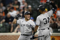 New York Yankees' Jose Trevino, left, celebrates his three-run home run with teammate Aaron Hicks (31) during the fourth inning of a baseball game against the Baltimore Orioles, Monday, May 16, 2022, in Baltimore. (AP Photo/Nick Wass)