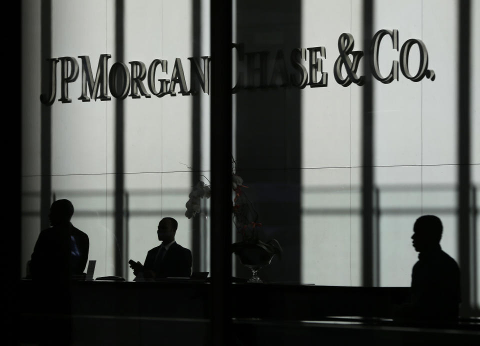 FILE - This Oct. 21, 2013, file photo shows the JPMorgan Chase & Co. logo displayed at their headquarters in New York. The nation's largest banks including JPMorgan are rewarding shareholders by spending tens of billions raising their dividends and buying back stock after getting the green light from the Federal Reserve. (AP Photo/Seth Wenig, File)