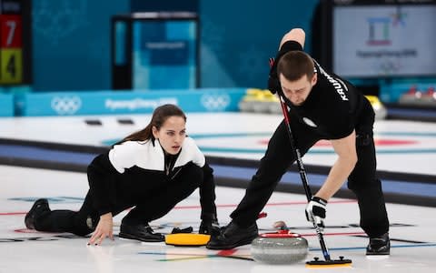 Alexander Krushelnitsky competing alongside his wife, Anastasia Bryzgalova (left) - Credit: TASS