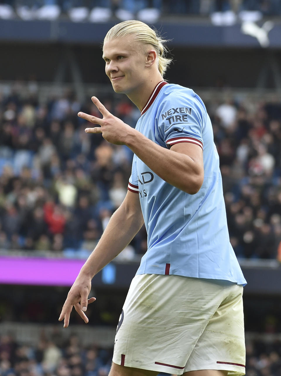 Manchester City's Erling Haaland celebrates after scoring his side's fifth goal and his personal hat trick during the English Premier League soccer match between Manchester City and Manchester United at Etihad stadium in Manchester, England, Sunday, Oct. 2, 2022. (AP Photo/Rui Vieira)