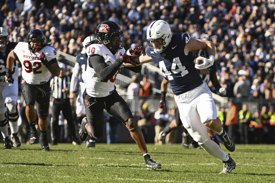 Penn State tight end Tyler Warren (44) runs past Rutgers defensive back Flip Dixon (10) during the first half of an NCAA college football game, Saturday, Nov. 18, 2023, in State College, Pa. (AP Photo/Barry Reeger)